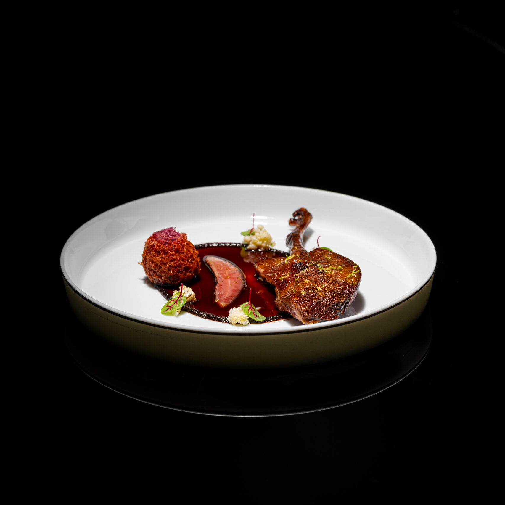 Chinese rock pigeon, black garlic, Shaoxing wine jus